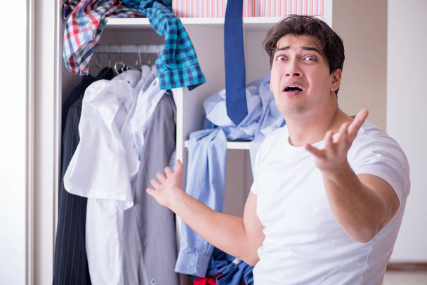 Man helpless with dirty clothing after separating from wife - Foto, immagini