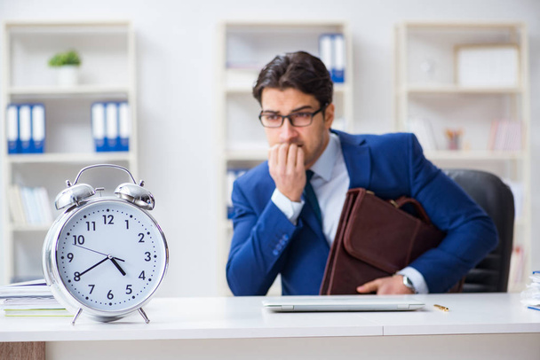 Businessman in bad time management concept - Photo, Image
