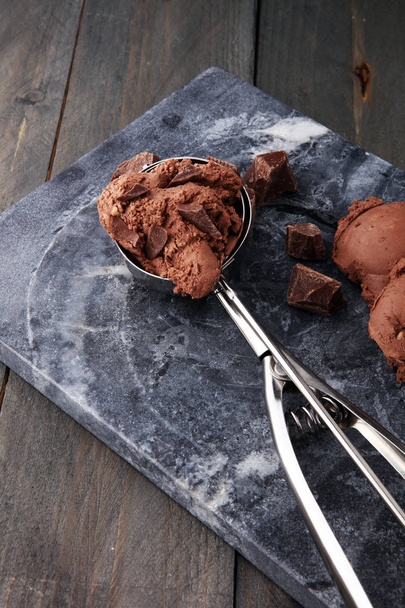 Chocolate ice cream scoop, scooped with a ice spoon. - Photo, Image