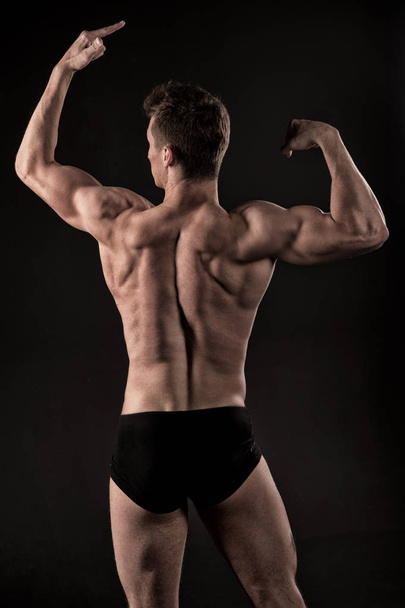 Sportsman with strong hands, biceps, triceps. - Foto, Bild