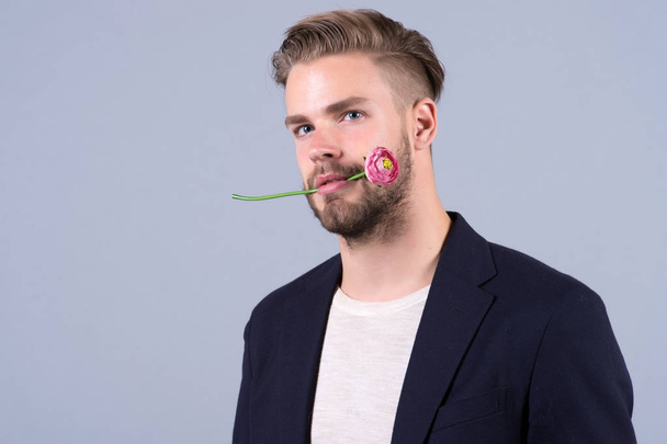 Man with flower in mouth, 8 march - Φωτογραφία, εικόνα