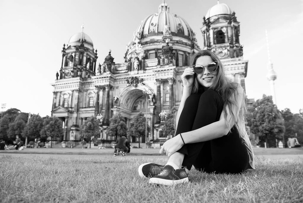Pretty gil sitting in front of Berlin Cathedral - Foto, Bild