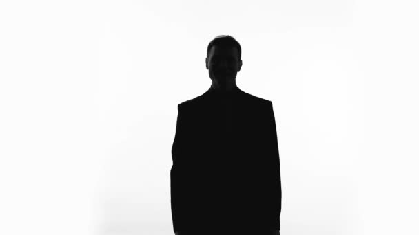 Happy businessman silhouette showing thumbs up, success, great achievement - Felvétel, videó