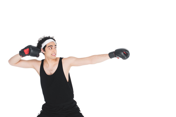 Young skinny boxer preparing to hit isolated on white - Φωτογραφία, εικόνα