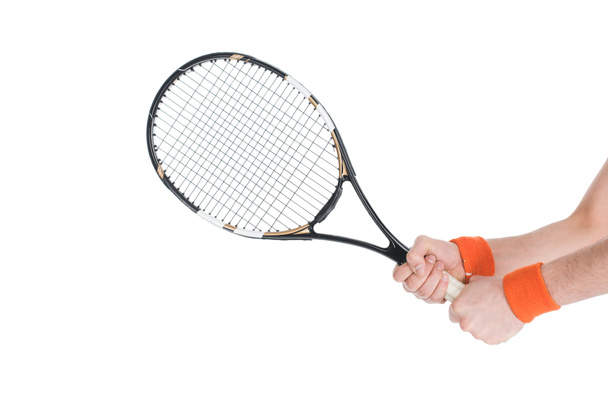 Cropped image of tennis player holding racket isolated on white - Photo, Image