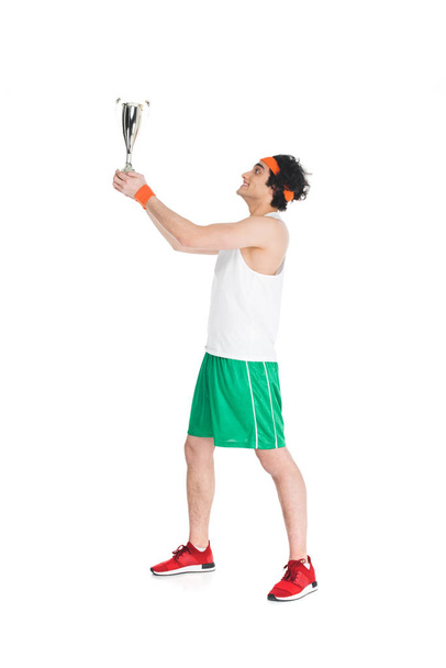Profile of happy sportsman holding trophy isolated on white - Φωτογραφία, εικόνα