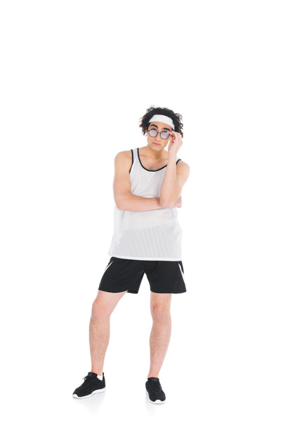 Skinny sportsman taking off eyeglasses isolated on white - Photo, Image