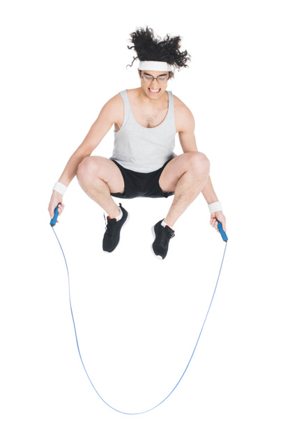Skinny sportsman doing jump rope workout isolated on white - Foto, Imagem