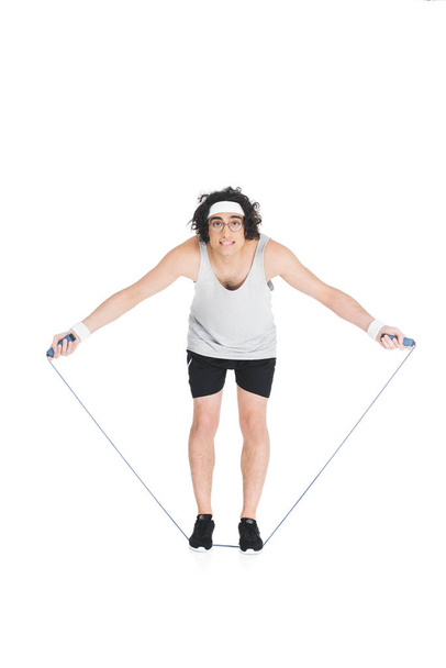  Thin sportsman in eyeglasses standing on jump rope isolated on white - Φωτογραφία, εικόνα