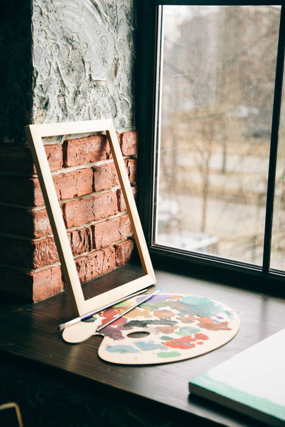 photo of a beautiful artist frame on the window - Φωτογραφία, εικόνα