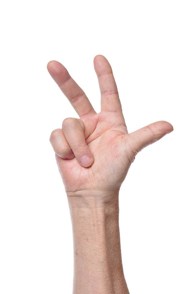 Hand of senior woman showing three fingers isolated on white background - Foto, Imagem