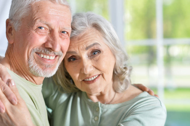 portrait of a happy senior couple hugging  at home - Zdjęcie, obraz