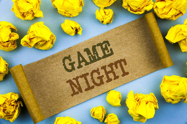 Word, writing, text  Game Night. Business concept for Entertainment Fun Play Time Event For Gaming written on tear paper with folded paper on the background. - Photo, Image