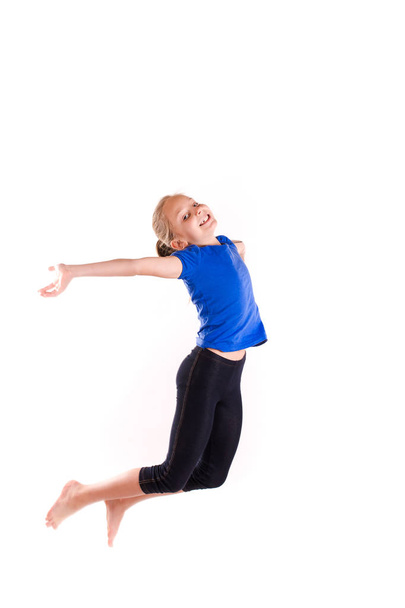 Active happy little girl jumping - Foto, Imagen