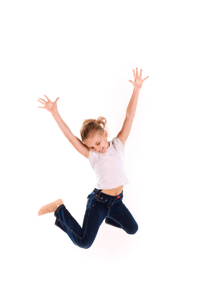 Active happy little girl jumping - Фото, изображение