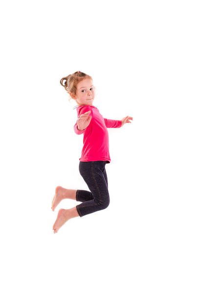 Active happy little girl jumping - Foto, Bild