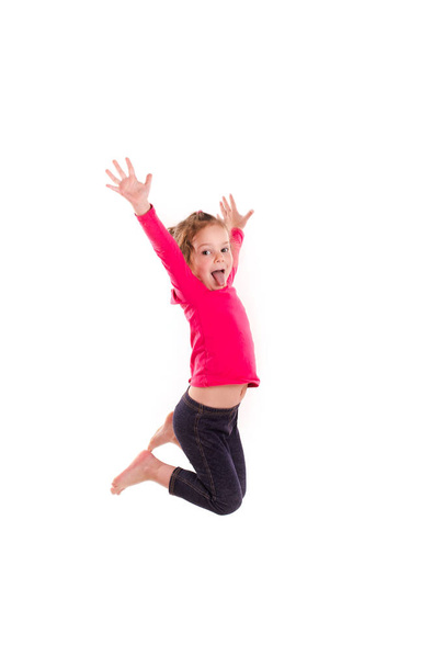 Active happy little girl jumping - Foto, imagen