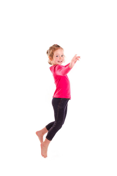 Active happy little girl jumping - Fotó, kép