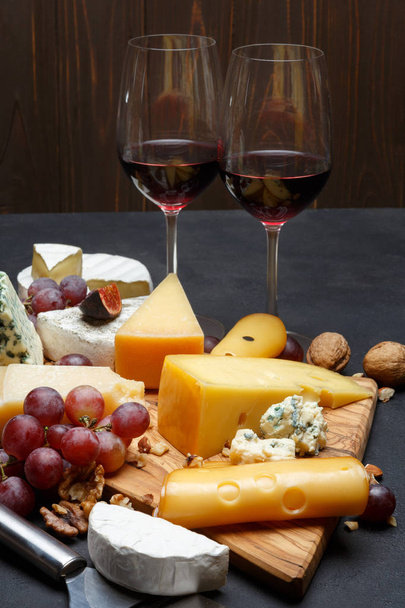 Wine and Various types of cheese - parmesan, brie, roquefort, cheddar - Photo, image