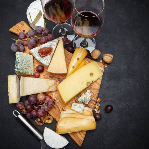 Wine and Various types of cheese - parmesan, brie, roquefort, cheddar - Photo, Image