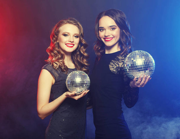 party and people concept: Party girls with disco balls - Фото, зображення