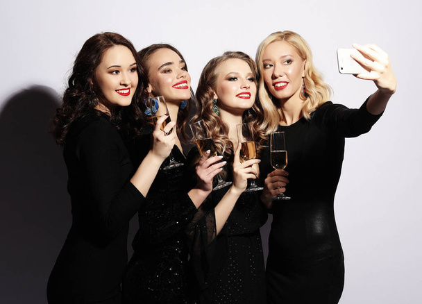 Close-up shot of group of laughing girls having party, take self - Photo, image