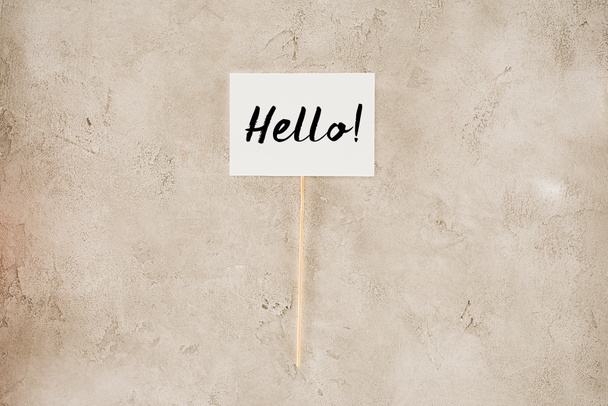 top view of hello lettering on placard on concrete surface - Photo, Image