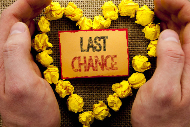 Conceptual writing showing Last Chance. Business photo showcasing Announcement Alert Time or Deadline Ending written on Sticky Note Paper With Heart Holding Hand with Finger - Photo, Image