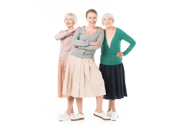 drei stylische Frauen in Röcken, die isoliert auf weiß stehen - Foto, Bild