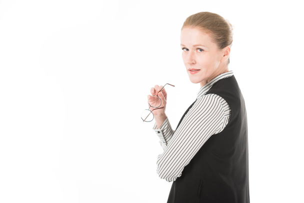 Stylish mature businesswoman holding eyeglasses isolated on white - Fotoğraf, Görsel
