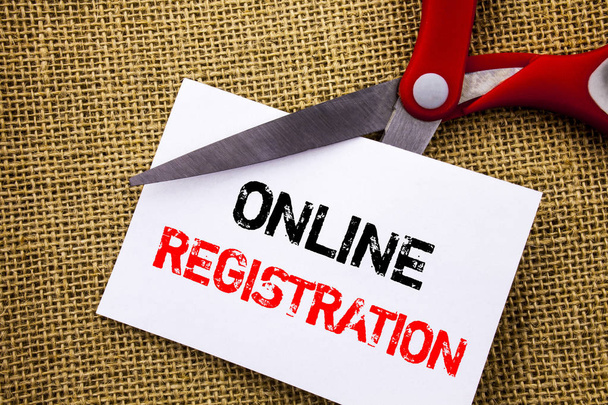Handwriting text showing Online Registration. Conceptual photo Register Web Subscription Subscribe written on Sticky Note Paper Cutting by Scissors on the textured background - Photo, Image