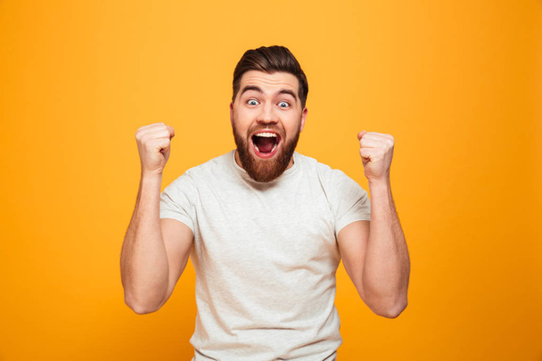 Portrait of an excited bearded man celebrating success - Photo, image