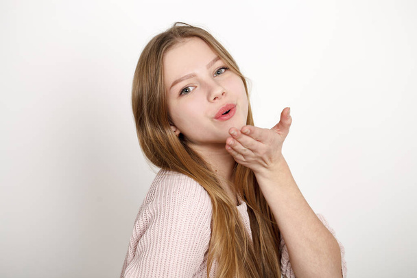Blow kiss, young caucasian blonde woman - Photo, Image