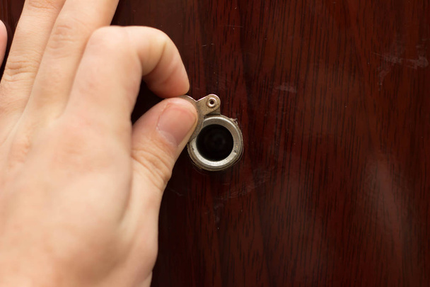 Peephole on wooden door - judas hole - Photo, Image