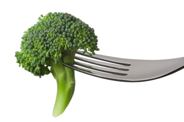 Raw broccoli on a fork - Photo, Image