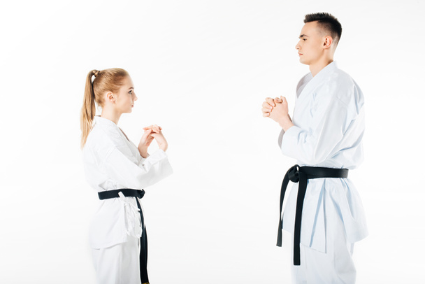karateków rozciąganie palców na białym tle - Zdjęcie, obraz