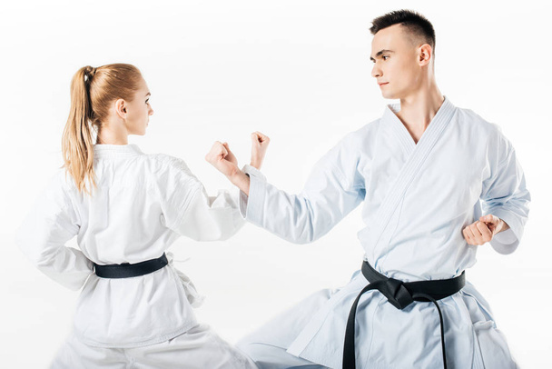 karateků ukazuje blok s rukama izolované na bílém - Fotografie, Obrázek