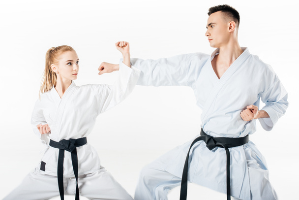 karateków szkolenia bloku na białym tle - Zdjęcie, obraz