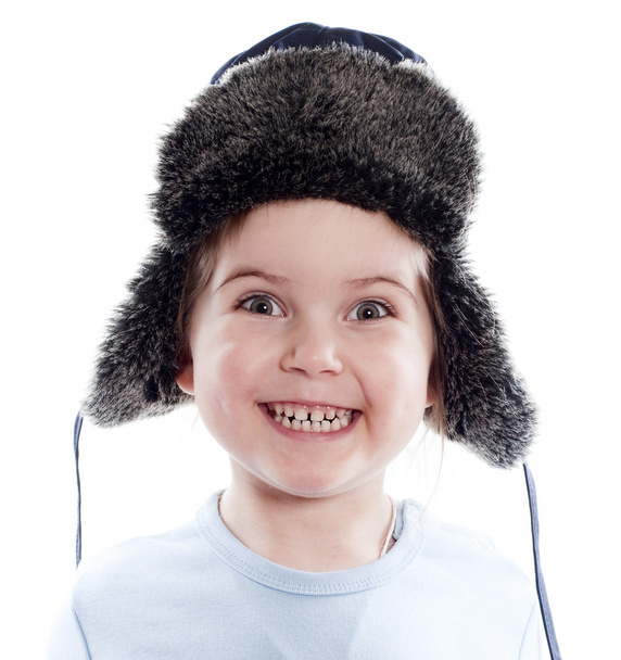 Allegro bambina indossa berretto blu con paraorecchie su bianco
 - Foto, immagini