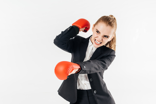 businesswoman screaming in suit and gloves isolated on white - Foto, afbeelding