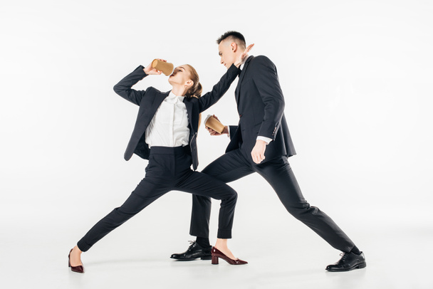 businesspeople fighting and drinking coffee in suits isolated on white - Photo, Image