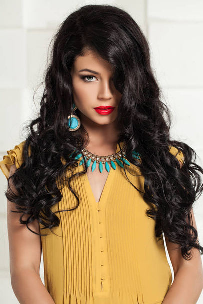 Fashion photo of beautiful brunette woman. Turquoise necklace - Photo, Image