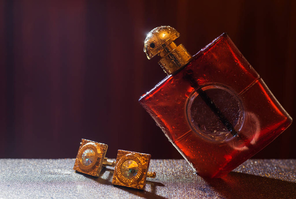 male perfume with cuff on dark background - Photo, Image