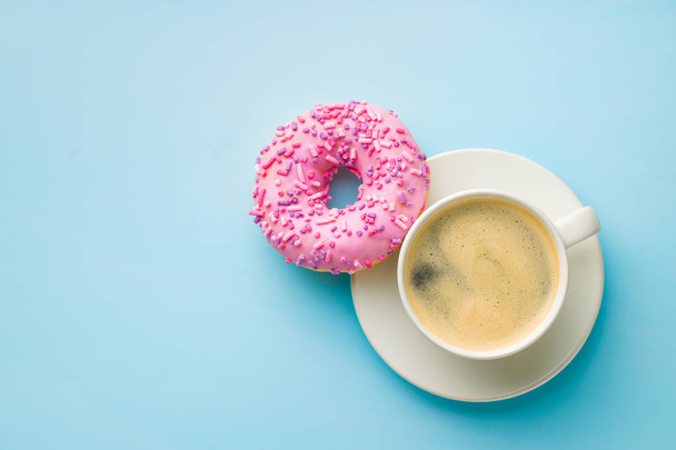 Pink donut and coffee cup. - Foto, Imagen