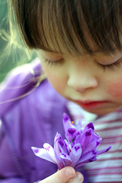 Portrait of beautiful young girl with flowers - Photo, Image