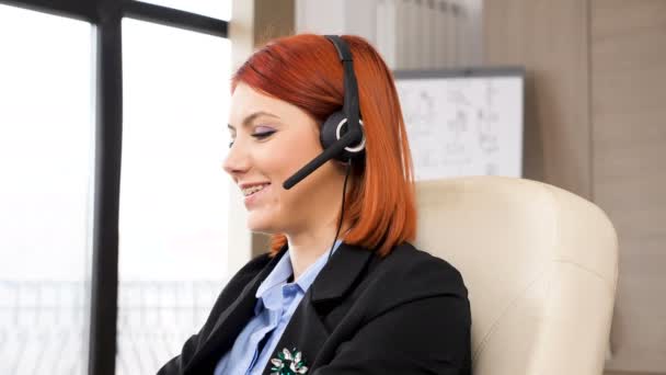 Sales representative with a headphones set on talking - Footage, Video