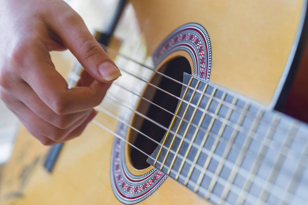woman's hands playing acoustic guitar, close up - Φωτογραφία, εικόνα