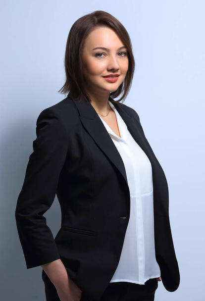 portrait of a successful young business woman on a light background. - Foto, Imagen