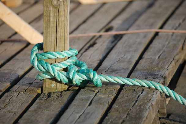 Mooring rope tied on the pier - Φωτογραφία, εικόνα