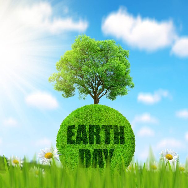 Green planet with tree in grass. Concept of Earth Day. - Photo, Image